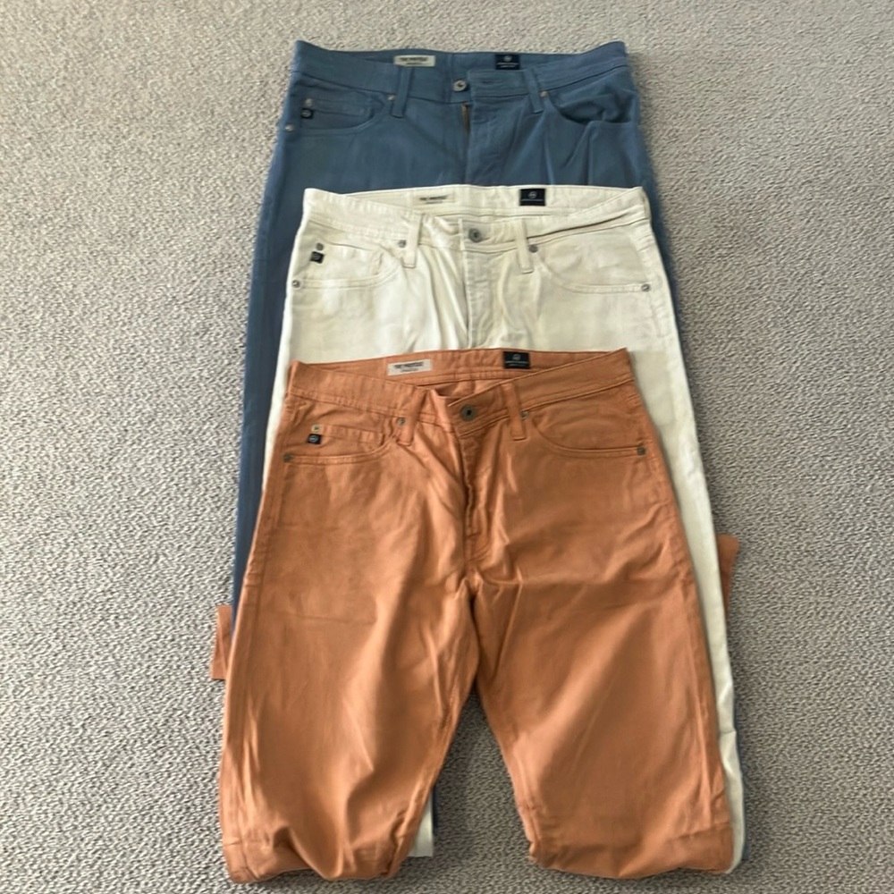 Three pairs AG Adriano Goldschmed pants. 31x30. Blue, tan, orange.